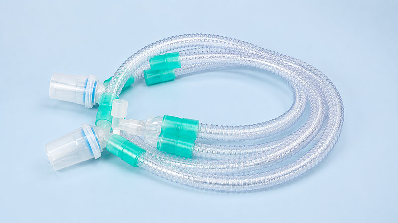 Reinforced breathing circuit with water trap